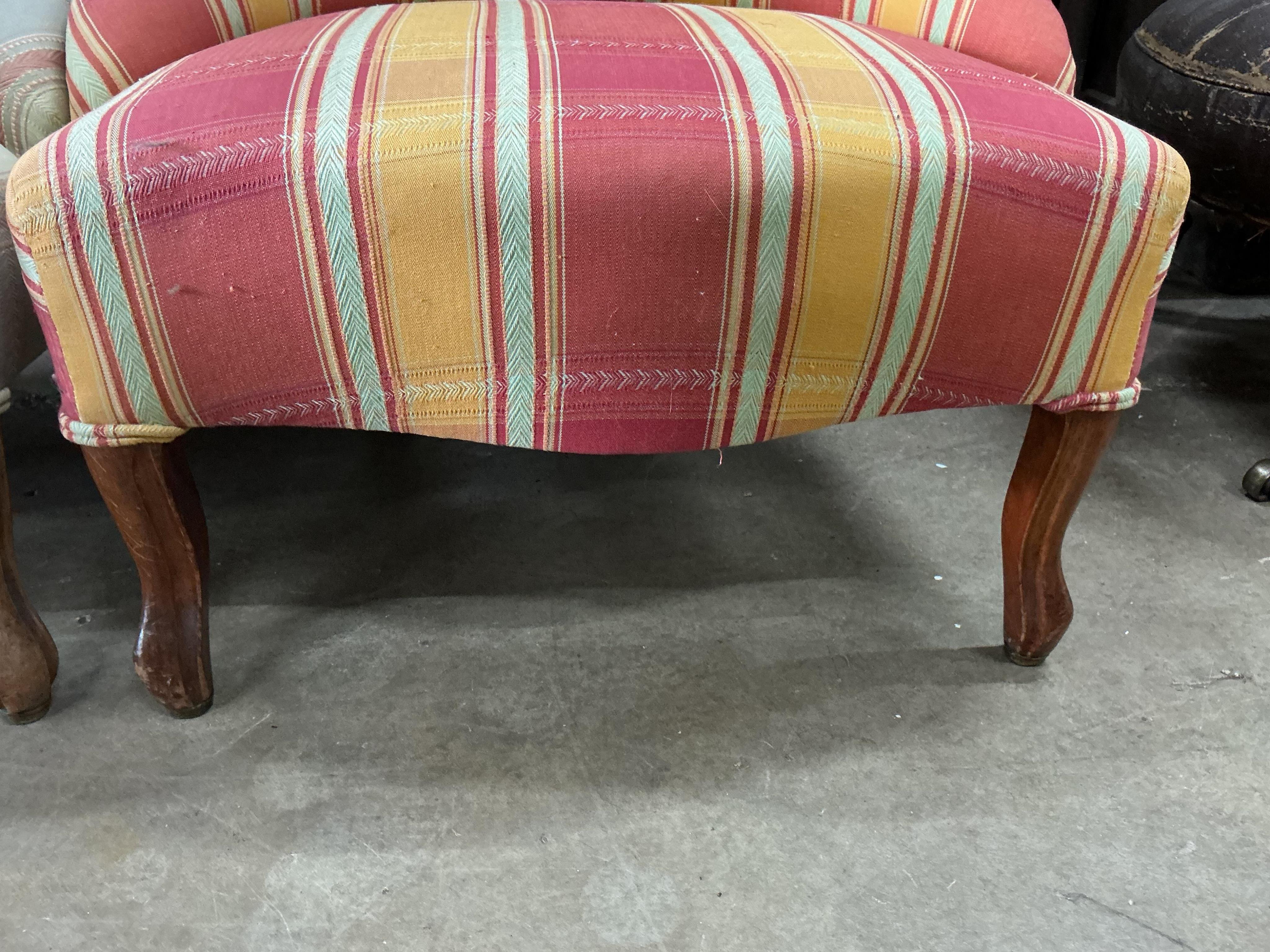 A pair of late 19th century upholstered mahogany nursing chairs, width 58cm, depth 50cm, height 70cm